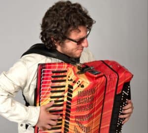Cory Pesaturo performs on an accordion