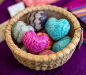 Basket of handmade ceramic hearts.