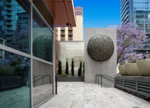 Beverly Penn, Global Proportion, 2019. Bronze inlayed plaza tiles and topiary sphere. Carte Hotel, San Diego. Photograph by Philipp Scholz.